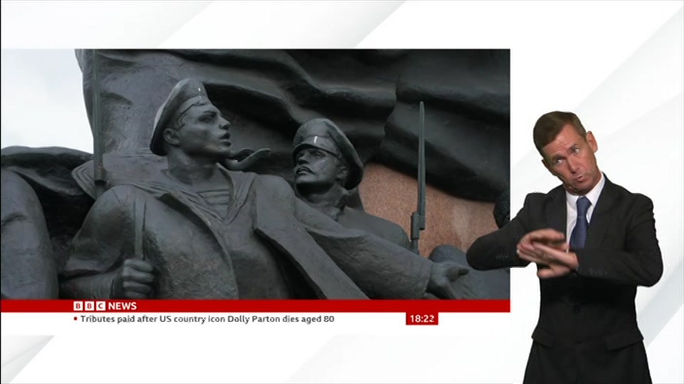 Broadcast still at 22m. BBC News, Signed: BBC News at Six, 26 August 2026.