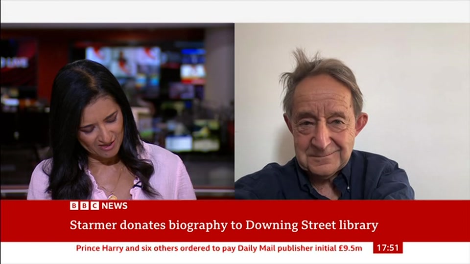 Broadcast still at 21m. BBC News, 21 August 2026.