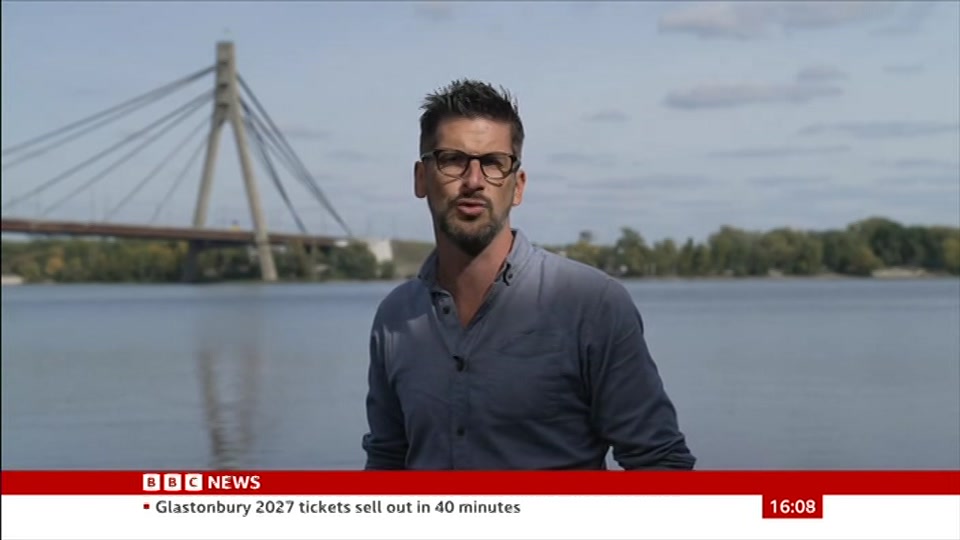 Broadcast still at 8m. BBC News, 4 October 2026.