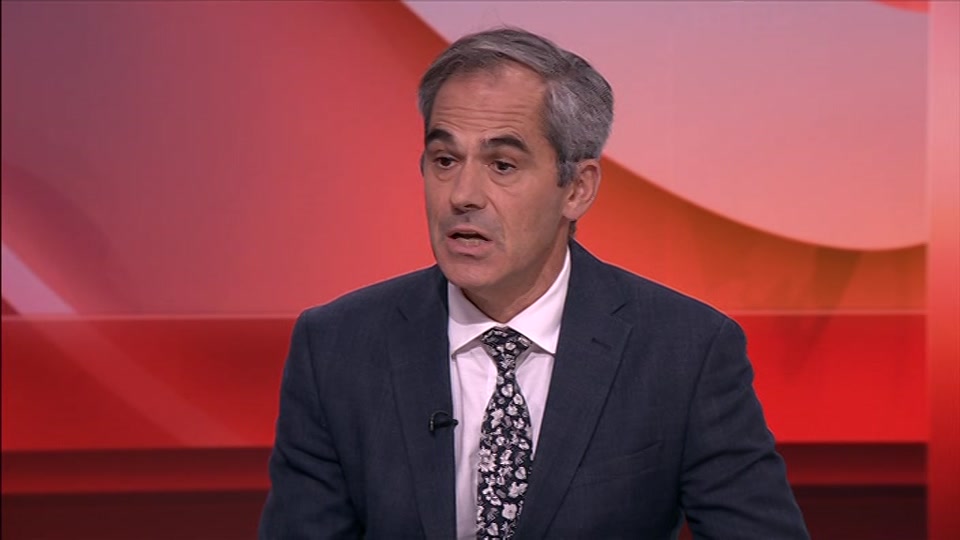 Broadcast still at 12m. BBC One, BBC News, 7 October 2026.