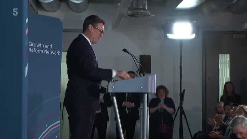 Broadcast still at 1m. Channel 5, 5 News at Lunchtime, 12 October 2026.