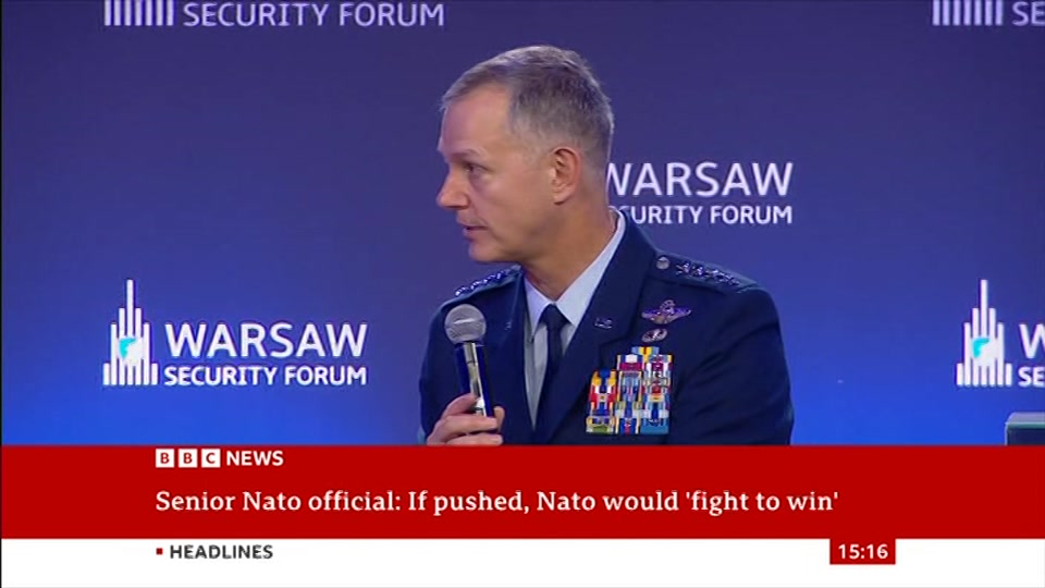 Broadcast still at 16m 30s. BBC News, Verified Live, 12 October 2026.