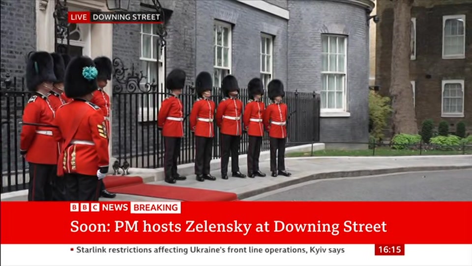 Broadcast still at 15m 30s. BBC News, Verified Live, 14 October 2026.
