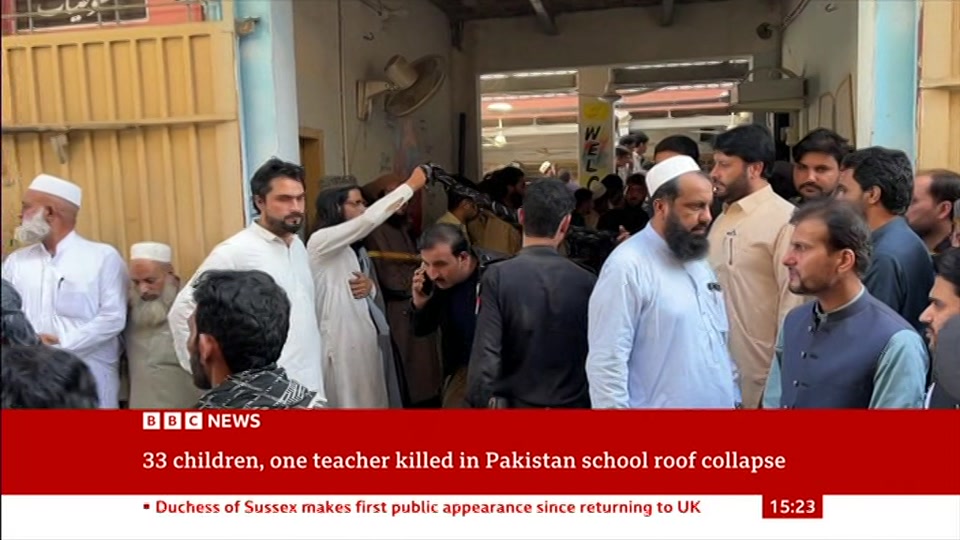 Broadcast still at 23m 30s. BBC News, Verified Live, 15 October 2026.
