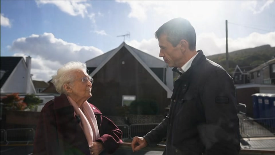 Broadcast still at 27m. BBC One, BBC News and Weather, 21 October 2026.