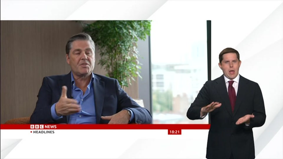Broadcast still at 21m. BBC News, Signed: BBC News at Six, 18 August 2026.