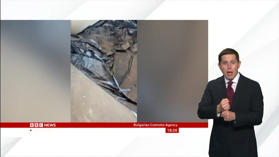 Broadcast still at 26m. BBC News, Signed: BBC News at Six, 18 August 2026.