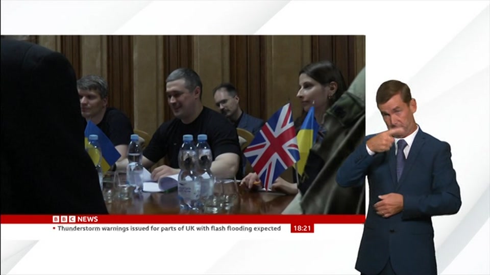 Broadcast still at 21m. BBC News, Signed: BBC News at Six, 19 August 2026.